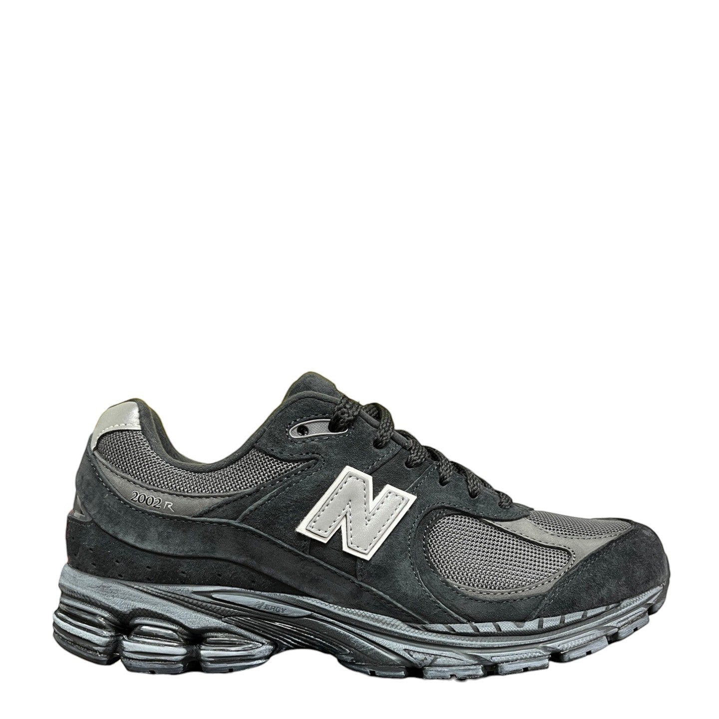 Luxury Chef New Balance 2002R black suede and mesh sneakers with silver N logo and grey sole.
