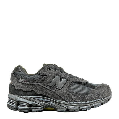 Luxury Chef New Balance 2002R dark grey suede and mesh sneakers with distressed detailing.