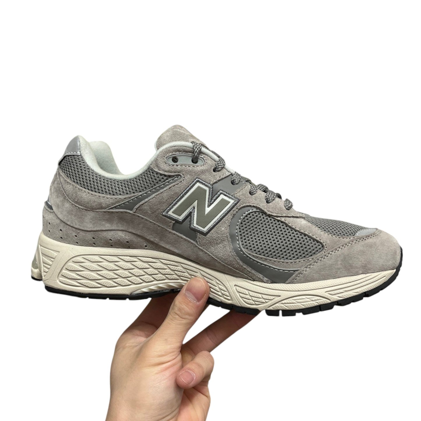 Luxury Chef New Balance 2002R grey suede and mesh sneakers with N logo.