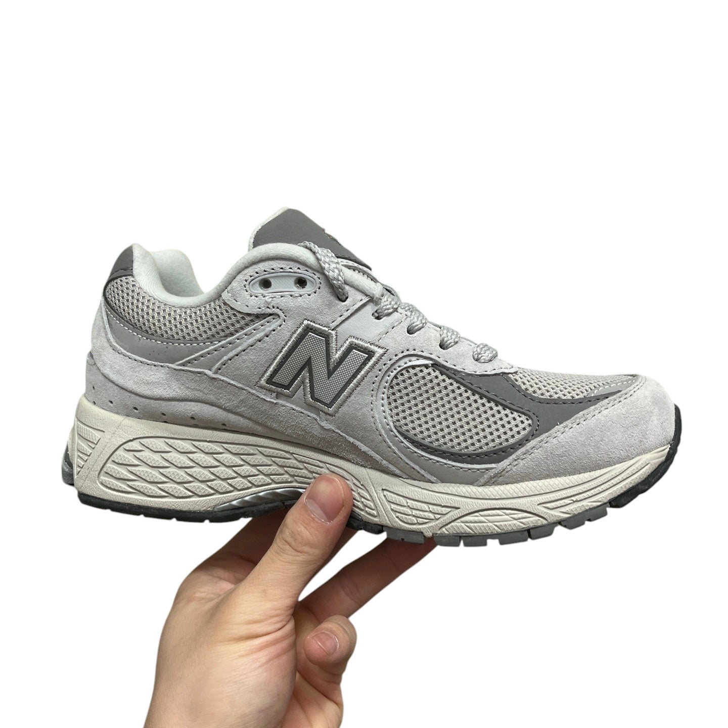 Luxury Chef New Balance 2002R grey suede and mesh sneakers with N logo.