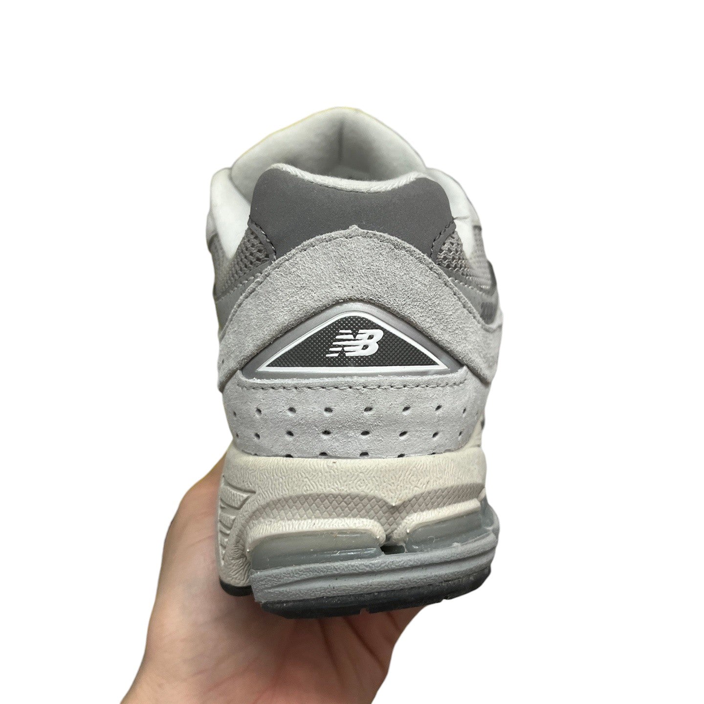 Luxury Chef New Balance 2002R grey suede and mesh sneakers with white accents and ABZORB cushioning.