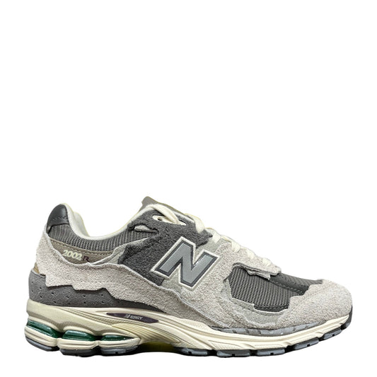 Luxury Chef New Balance 2002R sneakers in grey suede and mesh with cream midsole and green heel accents.