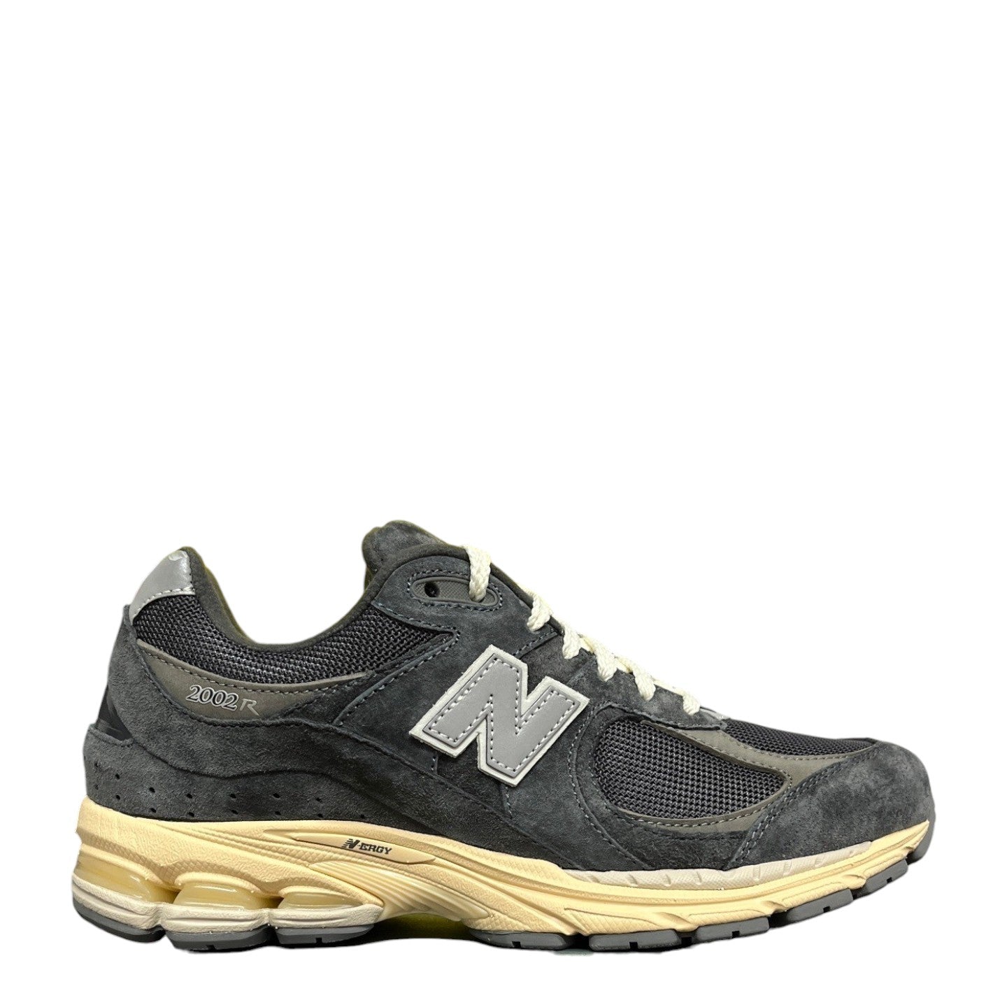 Luxury Chef New Balance 2002R dark grey suede and mesh sneakers with a cream midsole and grey N logo.
