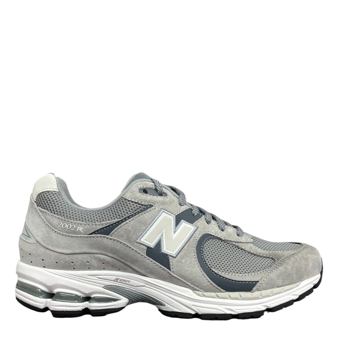 Luxury Chef New Balance 2002R grey suede and mesh sneakers with white N logo and white sole.