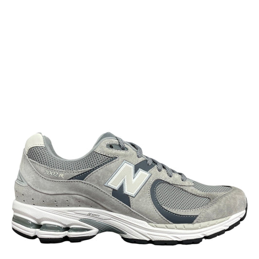 Luxury Chef New Balance 2002R grey suede and mesh sneakers with white N logo and white sole.