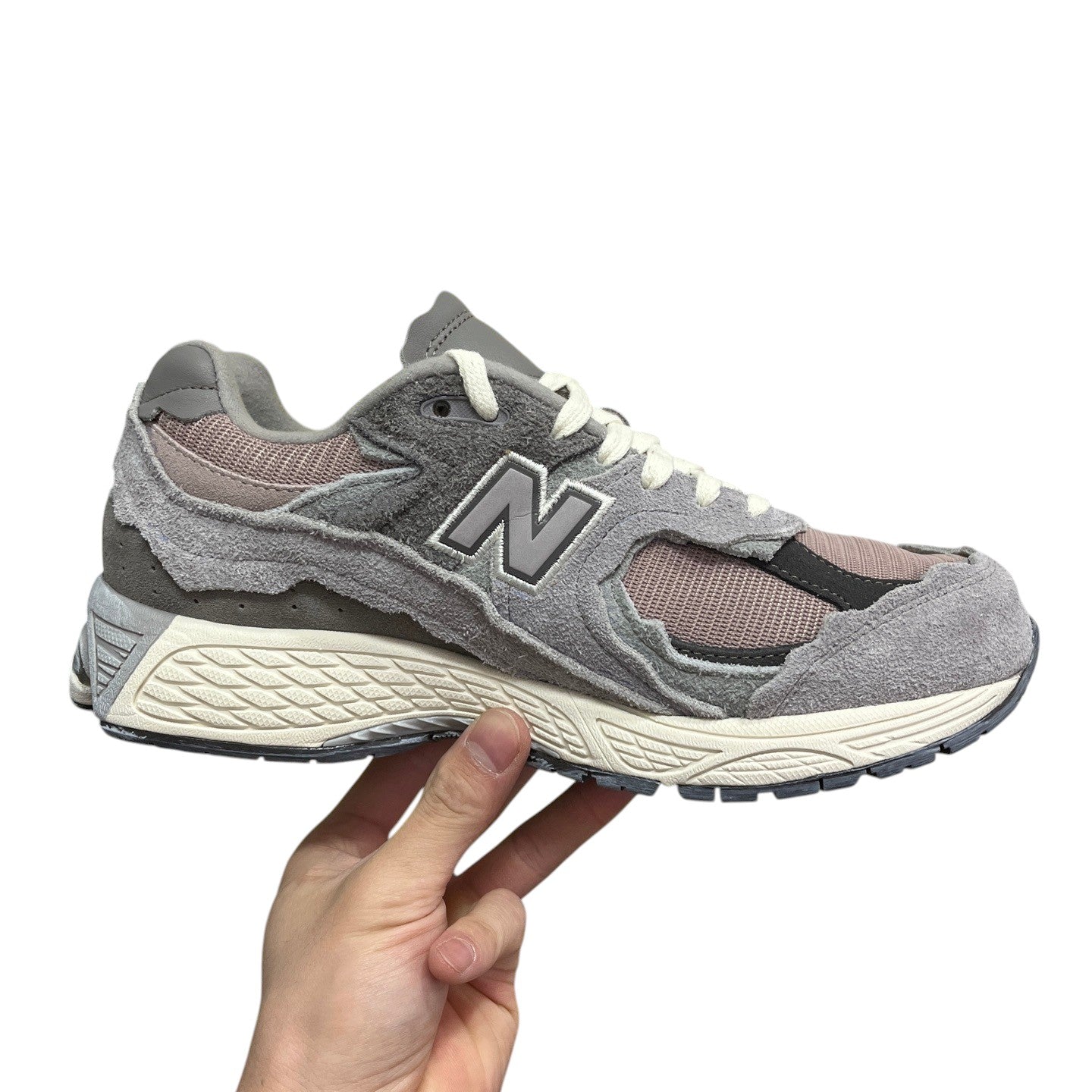 Luxury Chef NEW BALANCE 2002R grey suede and mesh sneakers with distressed detailing and cream sole.