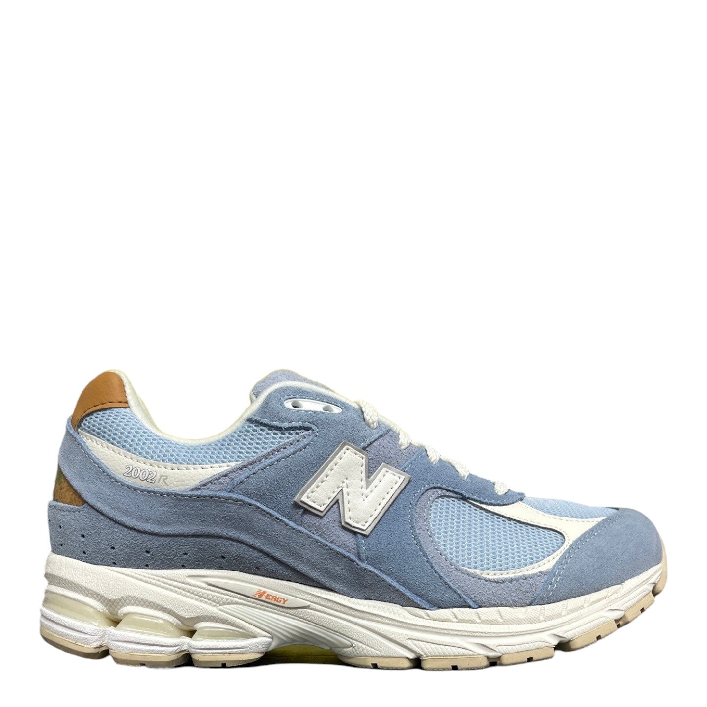 Luxury Chef New Balance 2002R light blue suede and mesh sneakers with white N logo and tan heel accent.