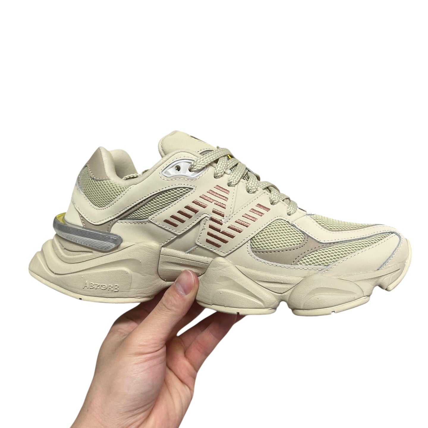 Luxury Chef New Balance 9060 beige mesh and leather sneakers with ABZORB sole and rose gold accents.