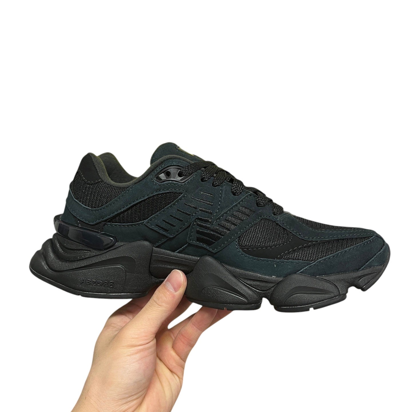 Luxury Chef New Balance 9060 black suede and mesh sneakers with chunky sole.