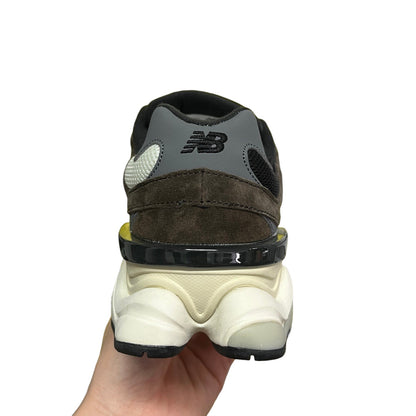 Luxury Chef New Balance 9060 sneakers in brown suede and grey with white accents and a chunky sole.