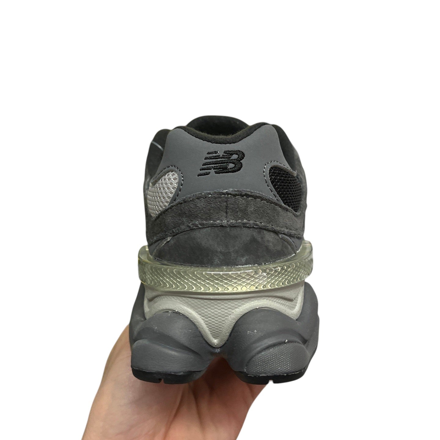 Luxury Chef New Balance 9060 dark grey suede and mesh sneakers with a translucent heel accent.