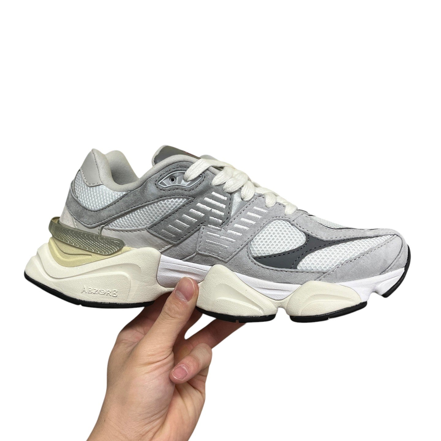 Luxury Chef New Balance 9060 grey suede and mesh sneakers with chunky cream sole and white laces.