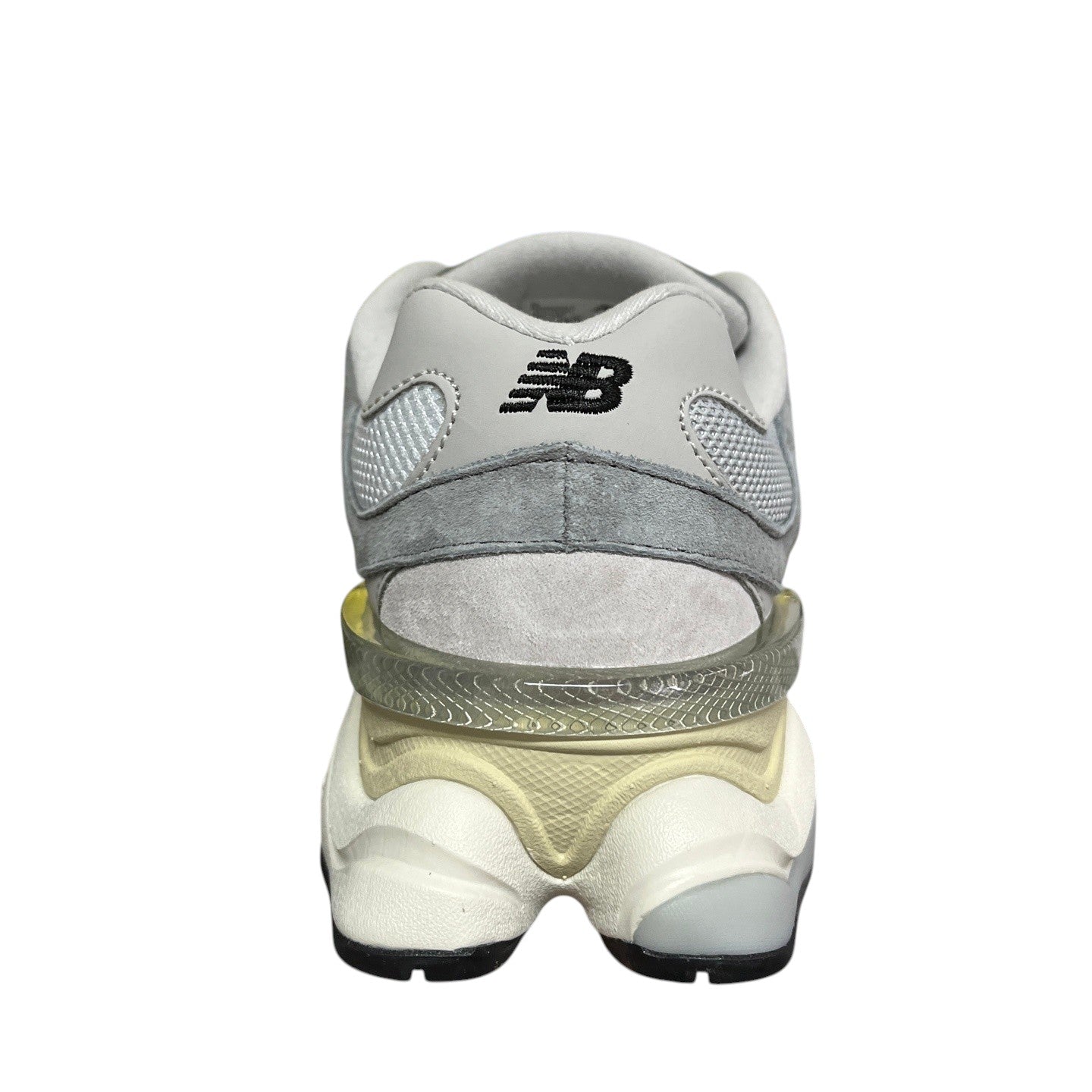 Luxury Chef New Balance 9060 grey suede and mesh sneakers with a translucent heel accent.