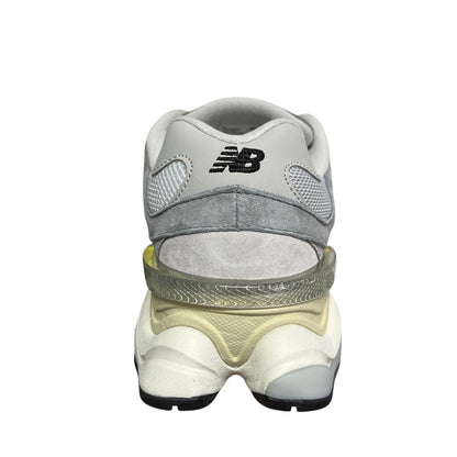 Luxury Chef New Balance 9060 grey suede and mesh sneakers with a translucent heel accent.