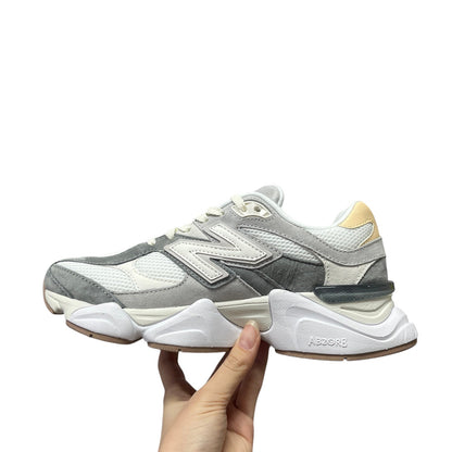 Luxury Chef New Balance 9060 grey and white mesh and suede sneakers with a chunky white sole.