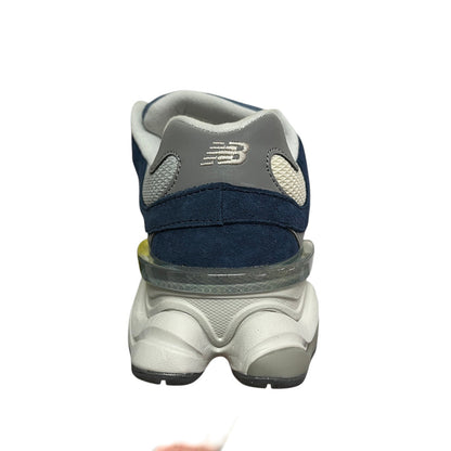 Luxury Chef New Balance 9060 navy blue suede and mesh sneakers with grey accents and a chunky white sole.