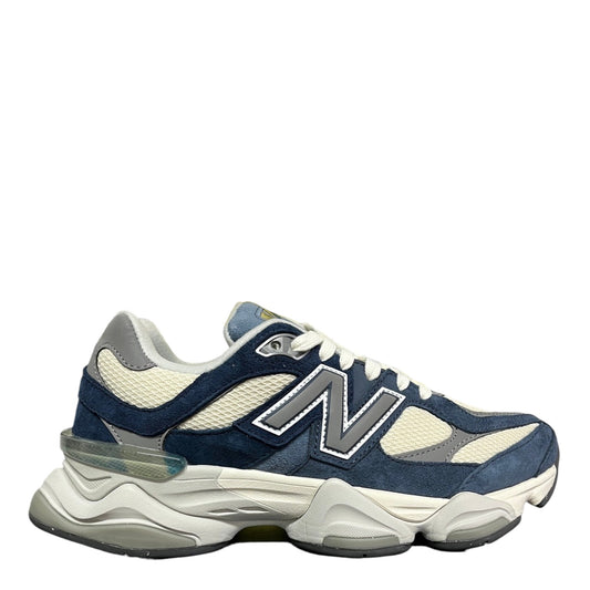 Luxury Chef New Balance 9060 sneakers in navy blue suede and cream mesh with grey accents and a chunky sole.