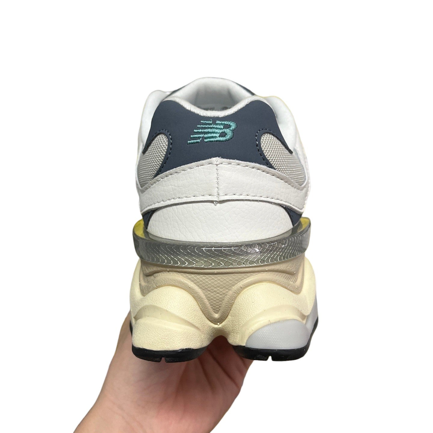 Luxury Chef New Balance 9060 sneakers in white, grey, and navy with a chunky cream sole and translucent heel detail.