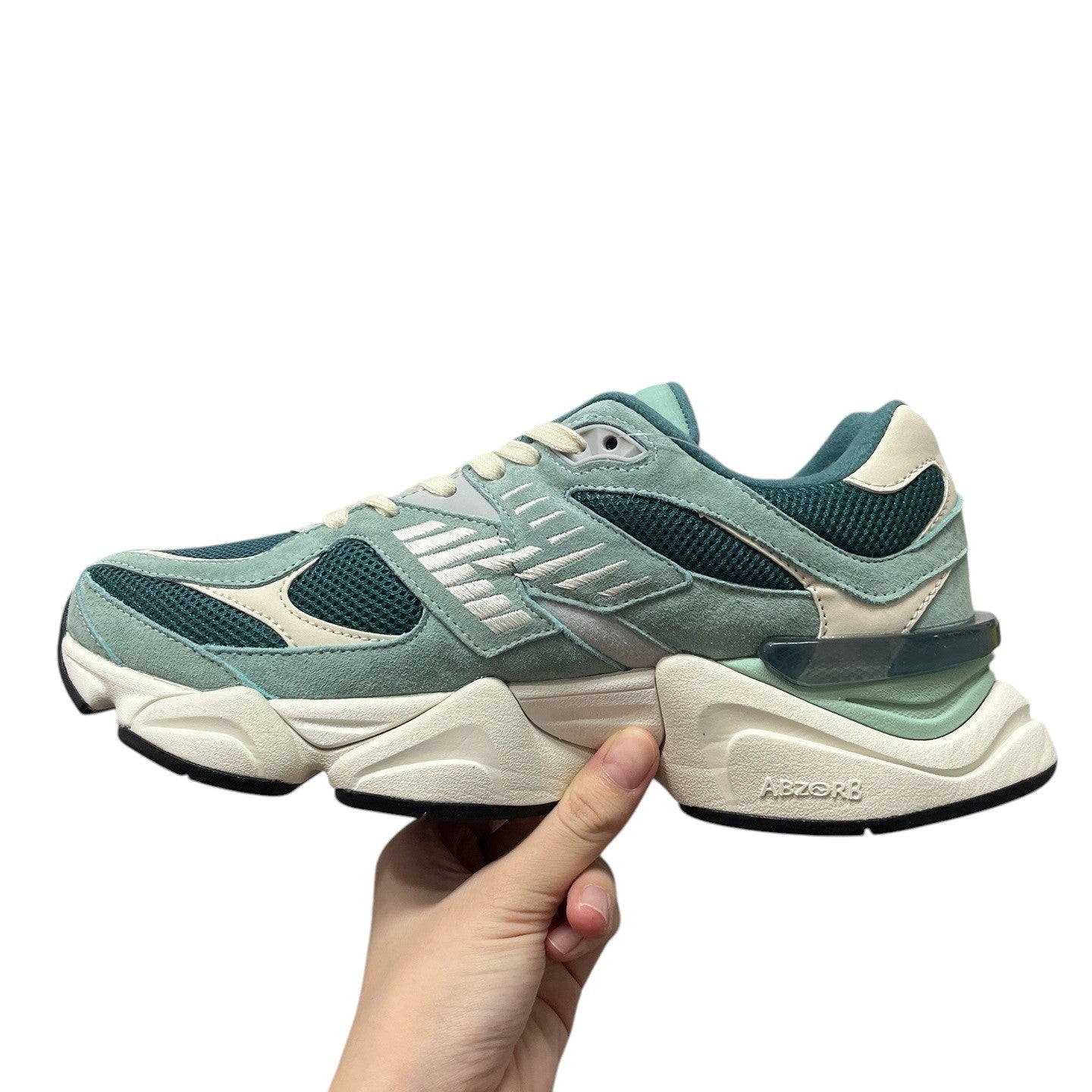 Luxury Chef New Balance 9060 sneakers in teal suede and mesh with cream accents and a chunky white sole.