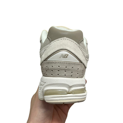 Luxury Chef NEW BALANCE 2002R beige suede and mesh sneakers with grey accents and N-ergy cushioning.