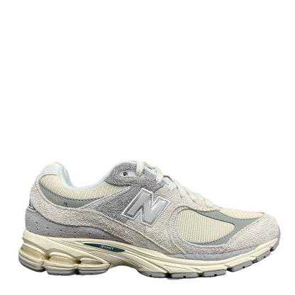 Luxury Chef New Balance 2002R sneakers in cream and light grey suede and mesh with N logo.