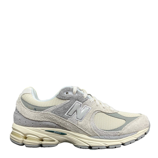 Luxury Chef New Balance 2002R sneakers in cream and light grey suede and mesh with N logo.