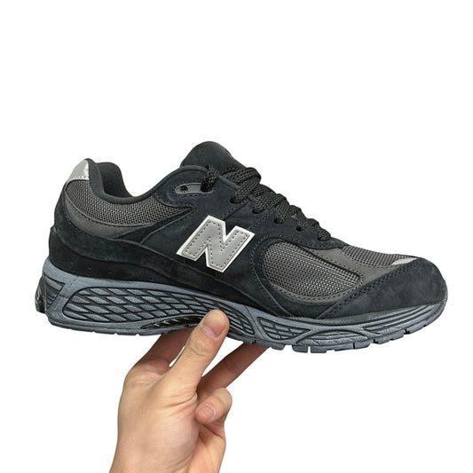 Luxury Chef New Balance 2002R dark grey suede and mesh sneakers with silver N logo.