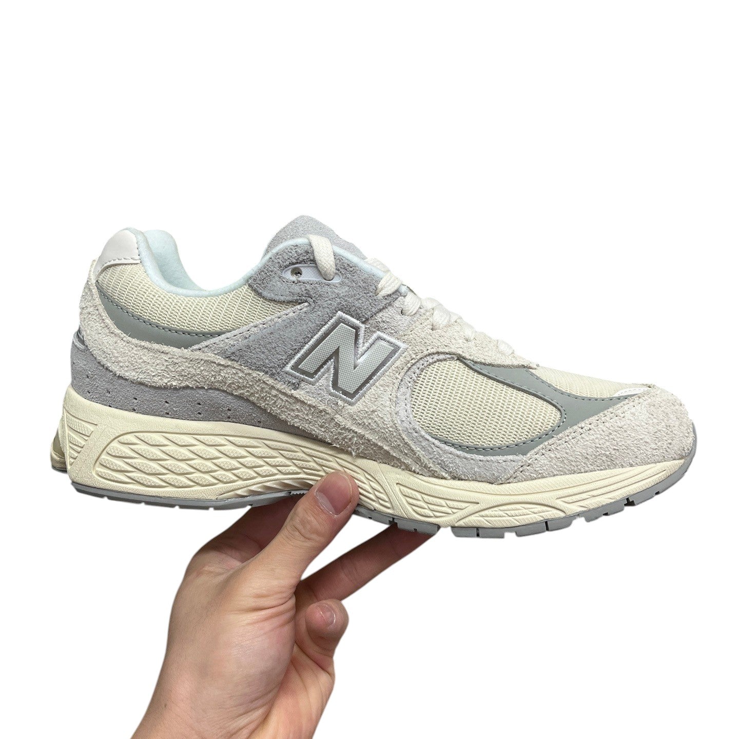 Luxury Chef NEW BALANCE 2002R light grey and cream suede and mesh sneakers.