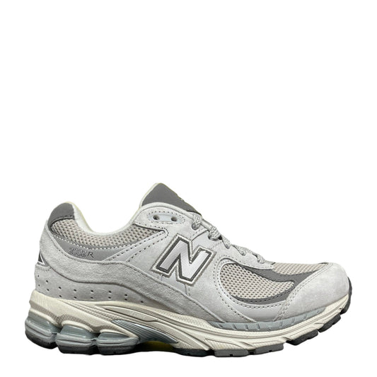 Luxury Chef New Balance 2002R light grey suede and mesh athletic sneakers with N logo.