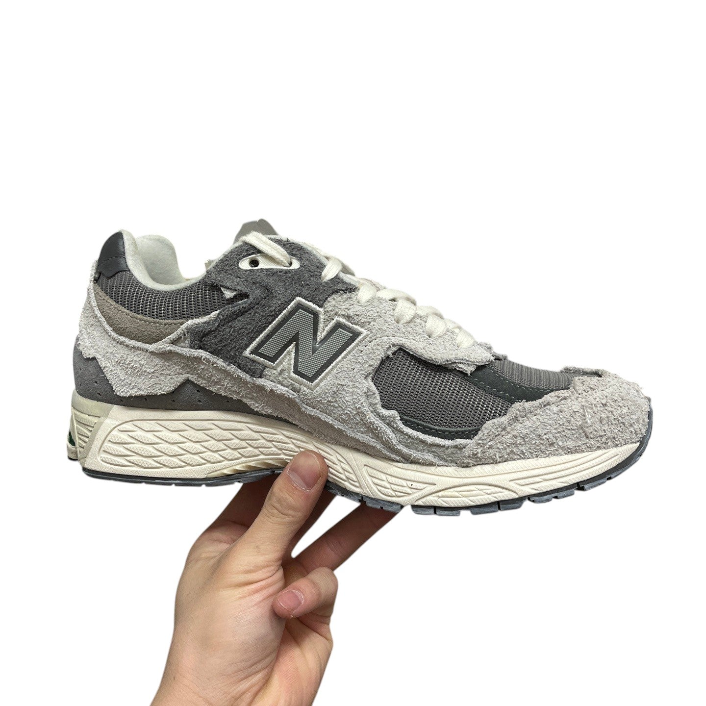 Luxury Chef New Balance 2002R sneakers in grey suede and mesh with distressed detailing.