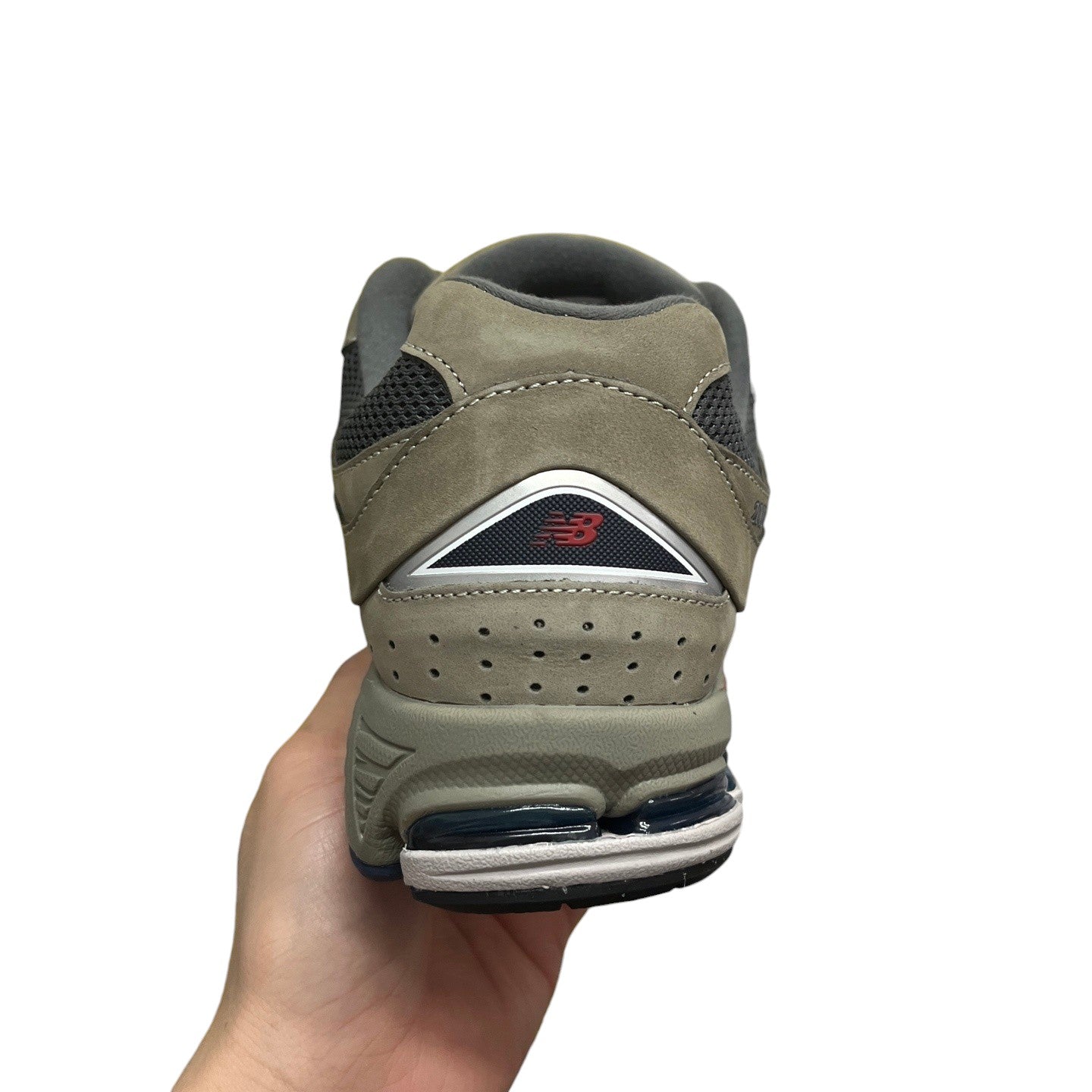 Luxury Chef New Balance 2002R grey suede and mesh sneakers with blue accents.