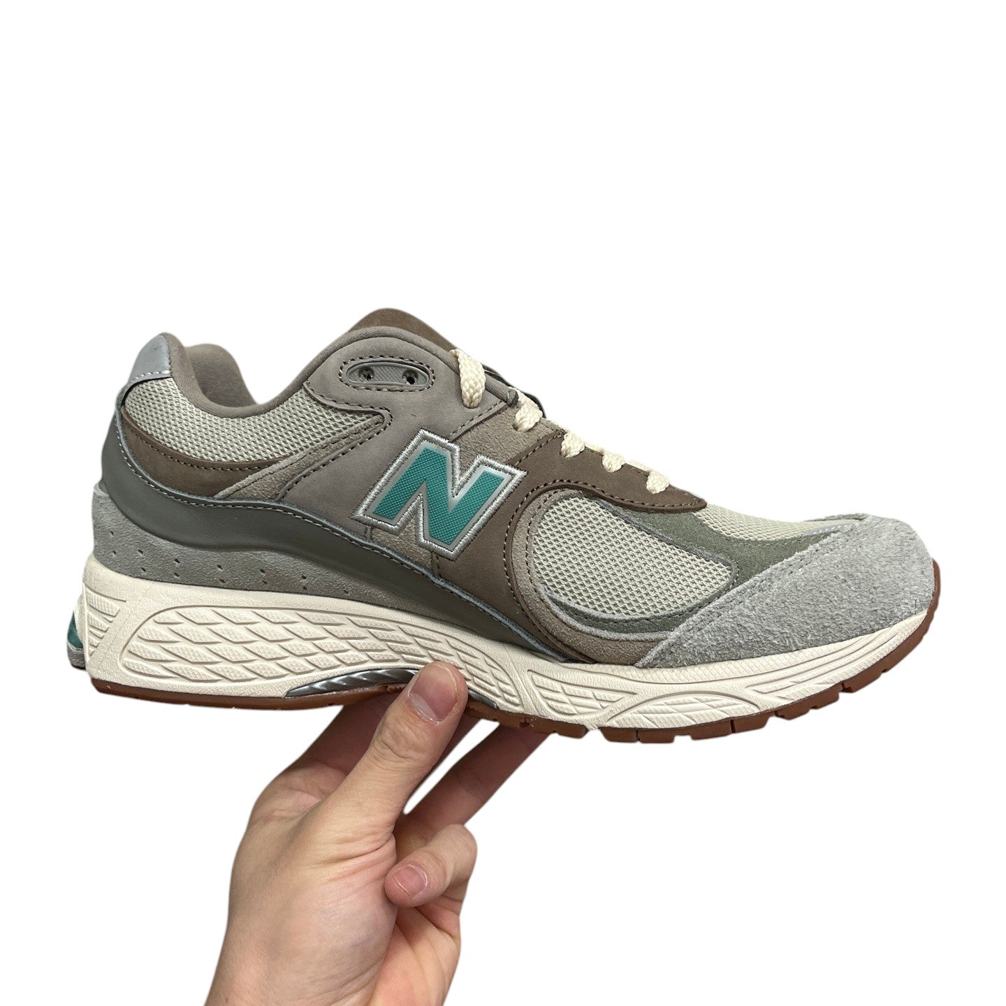 Luxury Chef New Balance 2002R grey and teal suede and mesh sneakers with white sole.
