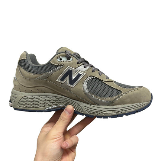 Luxury Chef New Balance 2002R taupe suede and mesh sneakers with navy N logo and silver accents.