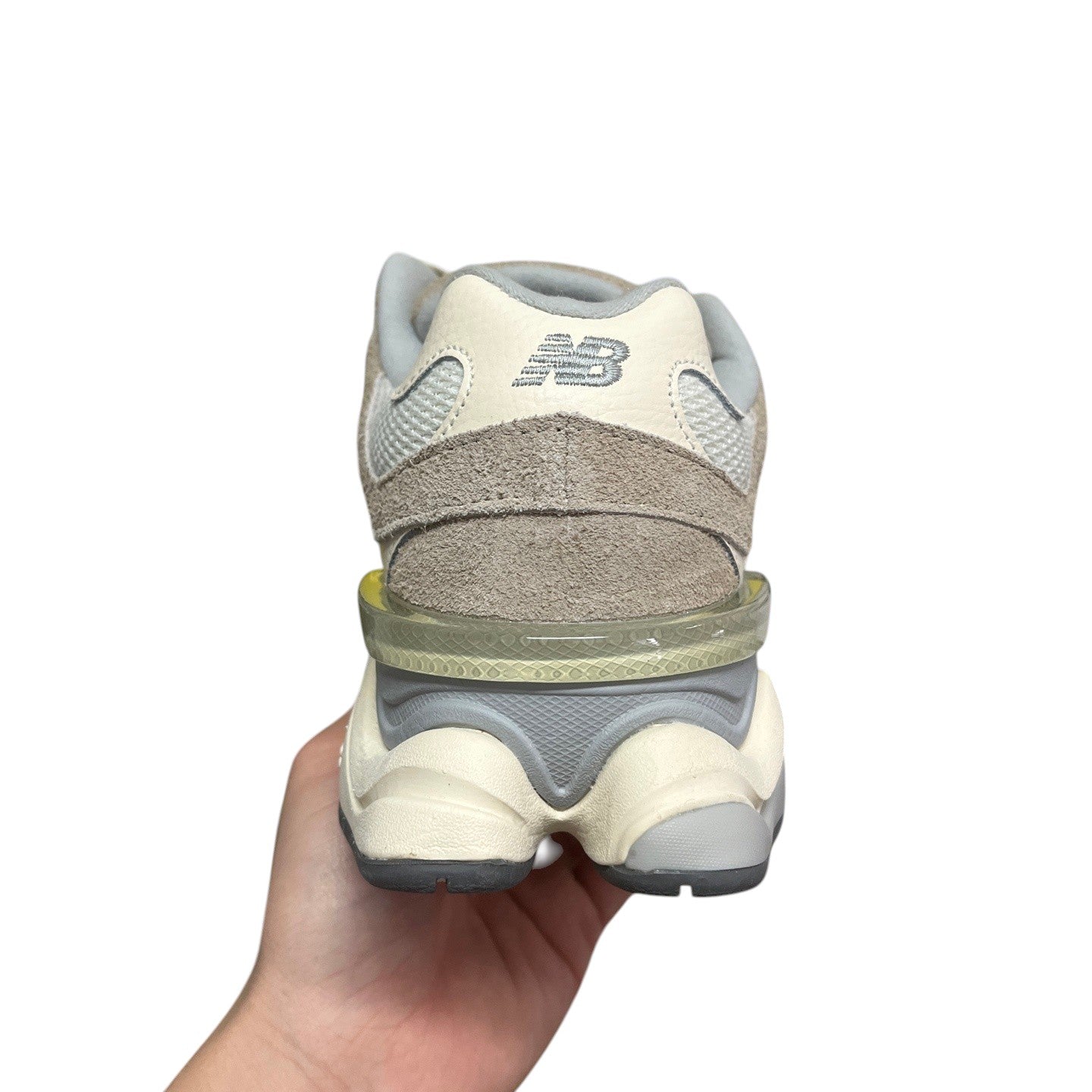 Luxury Chef New Balance 9060 beige and grey suede and mesh sneakers with translucent heel detail.
