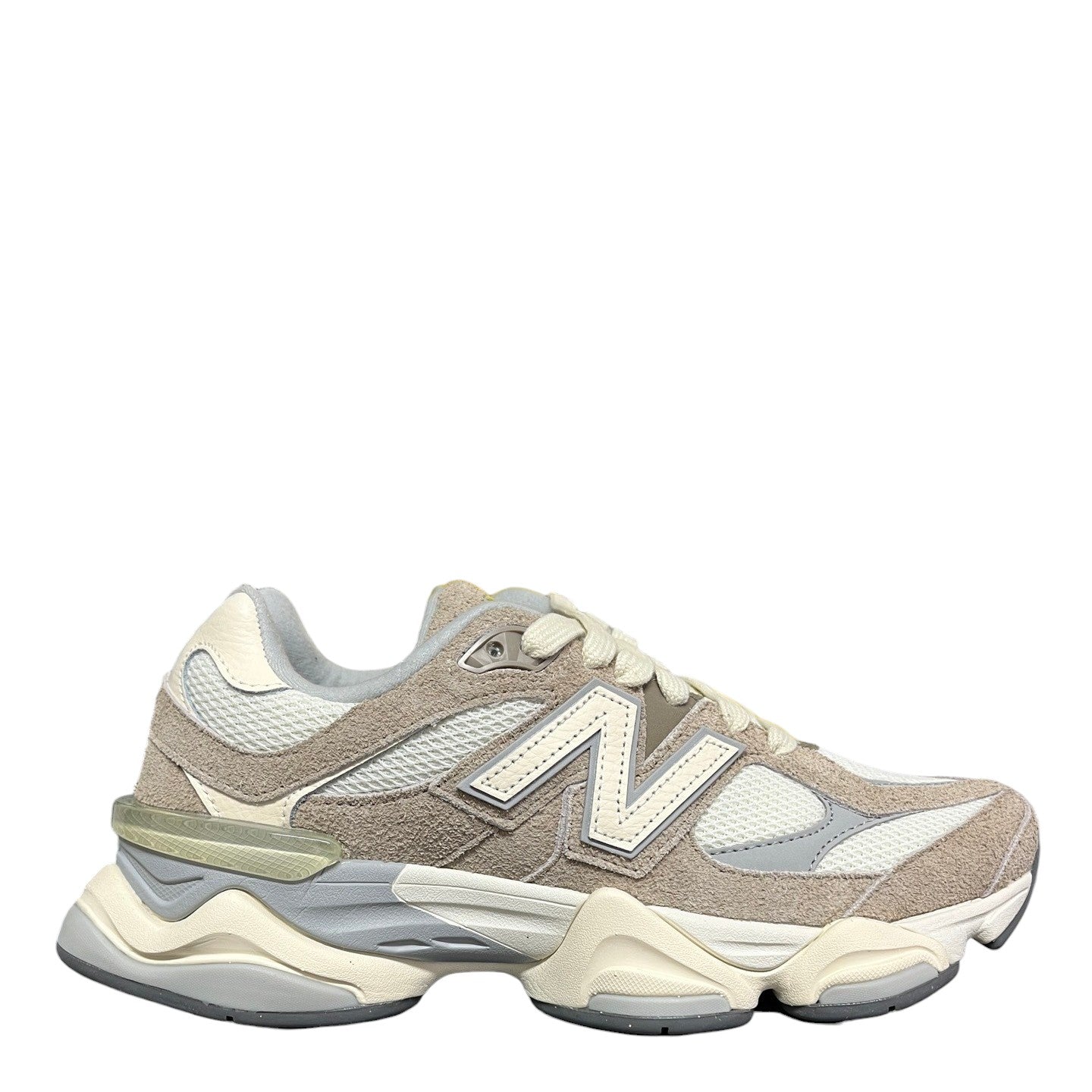 Luxury Chef New Balance 9060 beige and white suede and mesh sneakers with a chunky sole.