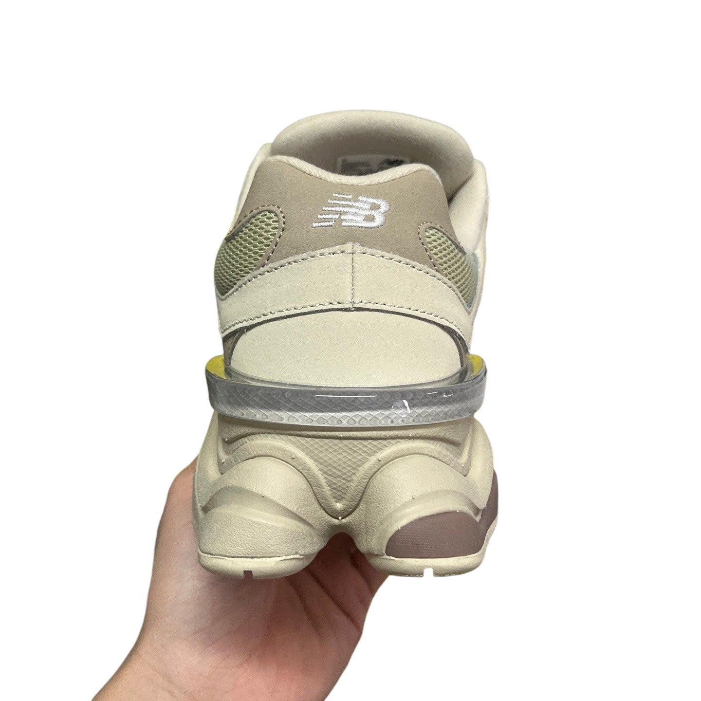 Luxury Chef New Balance 9060 beige mesh and leather sneakers with a clear heel accent.