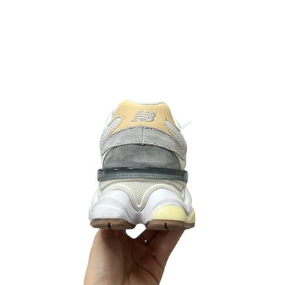 Luxury Chef NEW BALANCE 9060 sneakers in grey, white, and yellow with suede and mesh details.