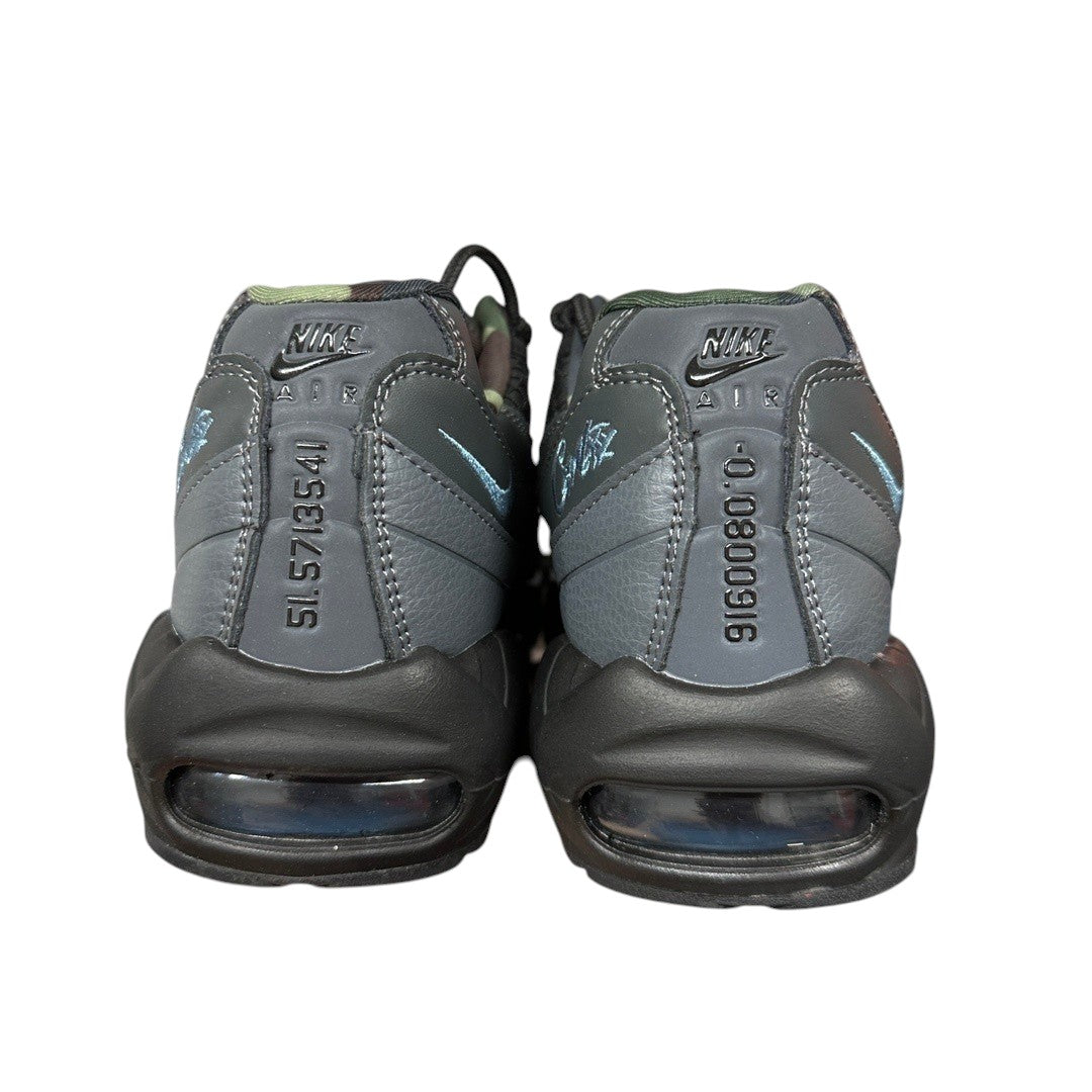 Luxury Chef Nike Air Max 95 Corteiz sneakers in grey with camouflage accents and blue Nike swoosh detail.