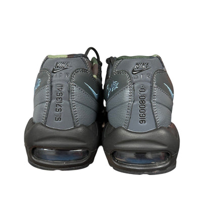 Luxury Chef Nike Air Max 95 Corteiz sneakers in grey with camouflage accents and blue Nike swoosh detail.
