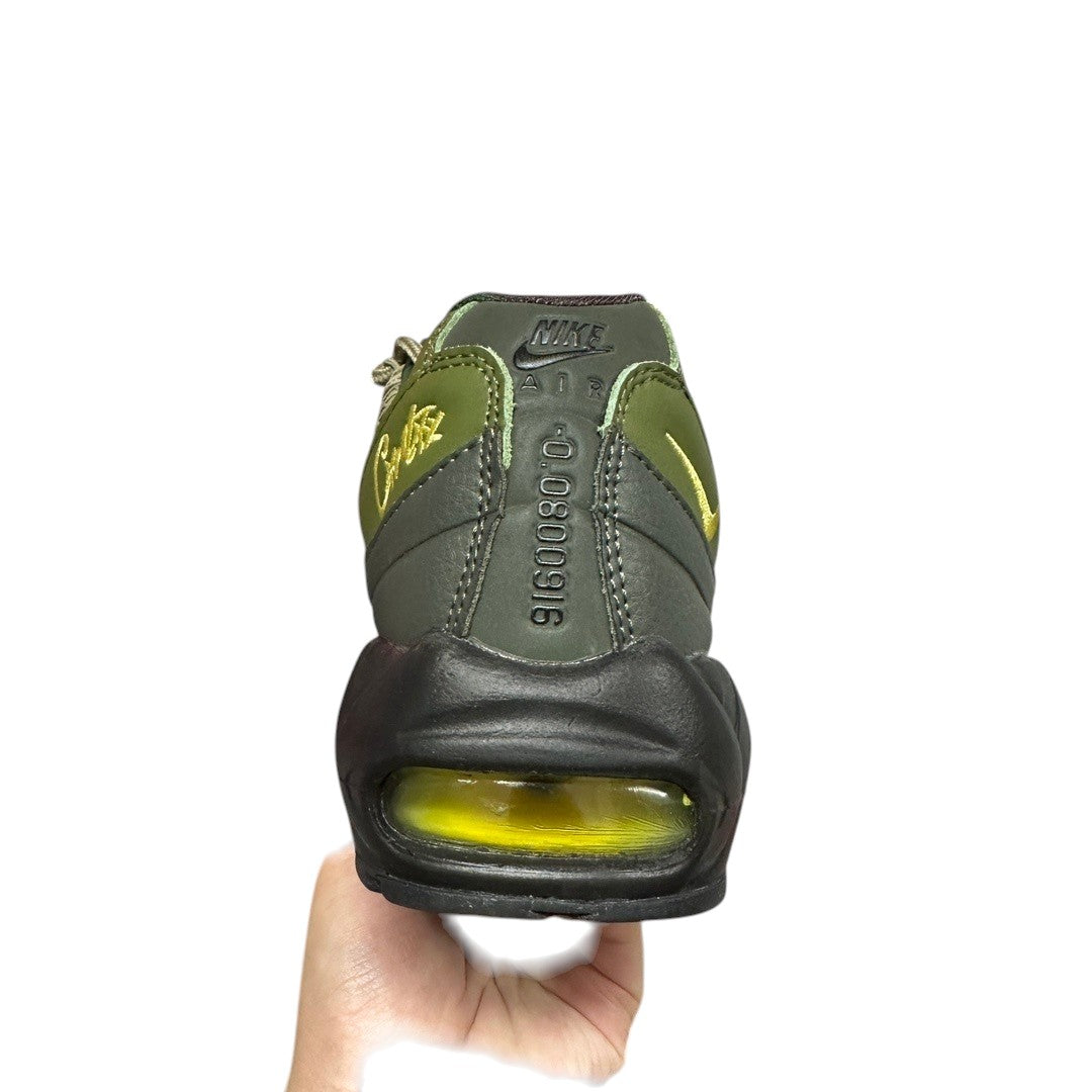 Luxury Chef Nike Air Max 95 Corteiz olive green sneakers with yellow accents and visible air cushioning.