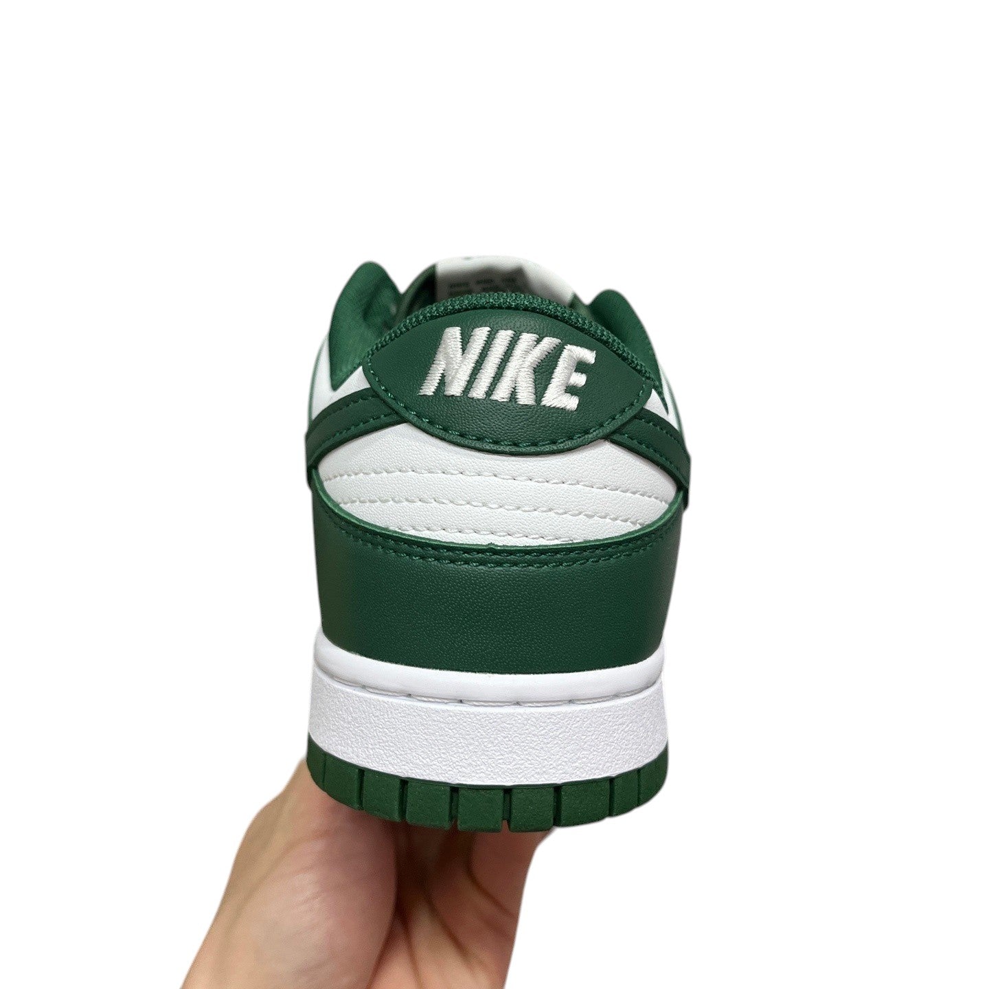 Luxury Chef Nike Dunk Low green and white leather sneakers with embroidered Nike logo on heel.