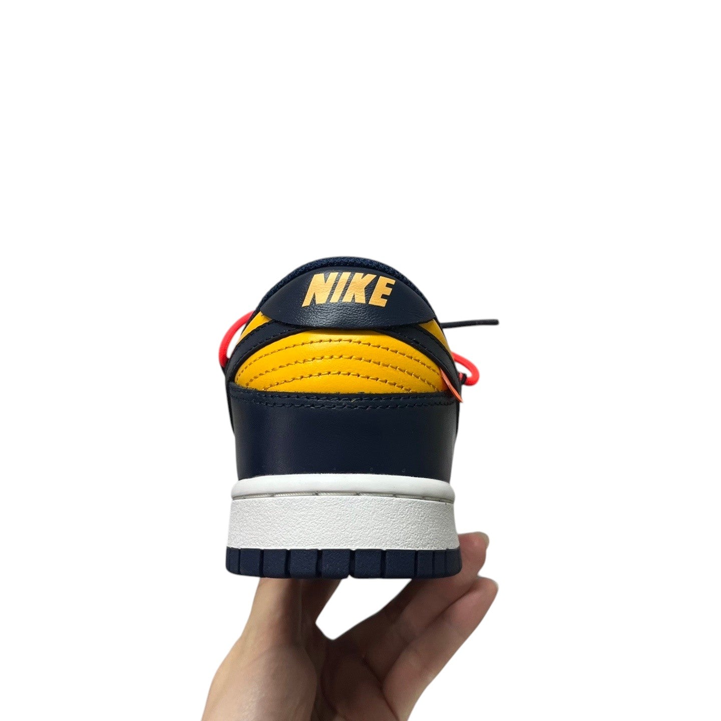 Luxury Chef Nike Dunk Low navy and yellow leather sneakers with white sole and orange accents.