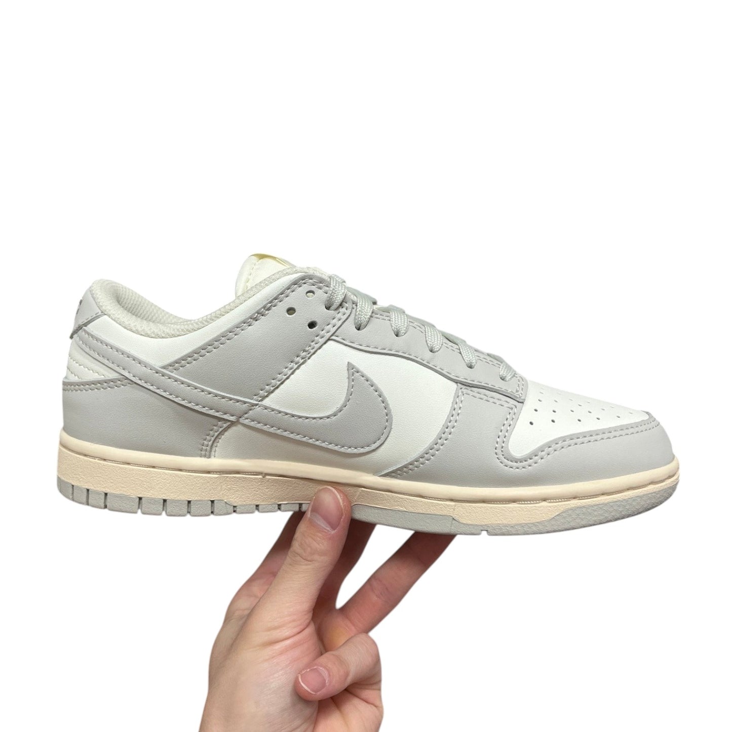Luxury Chef Nike Dunk Low sneakers in off-white and light grey leather with a cream sole.