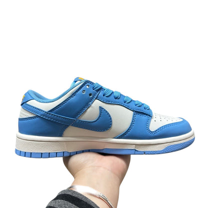 Luxury Chef Nike Dunk Low sneakers in white and sky blue leather with contrasting stitching and laces.