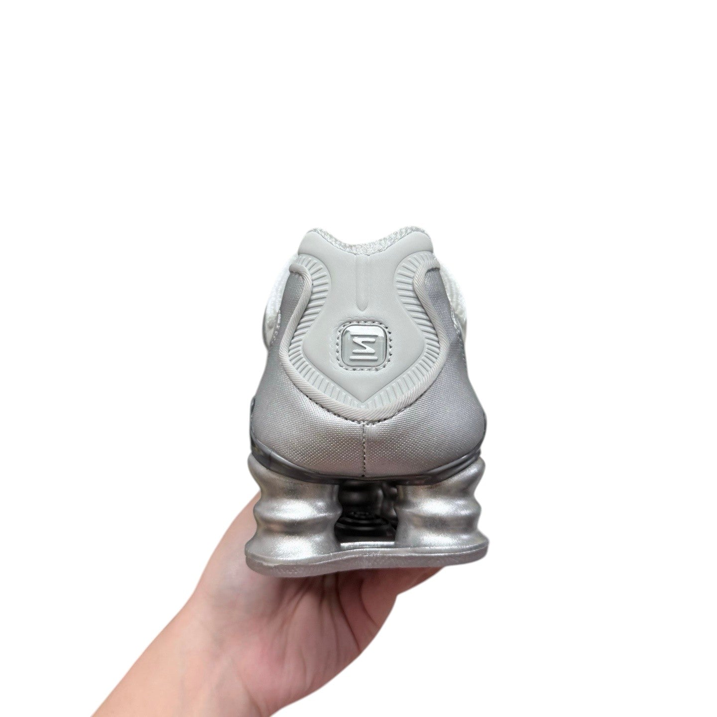Luxury Chef Nike Shox silver metallic sneakers with distinctive spring cushioning. Textile and synthetic upper.