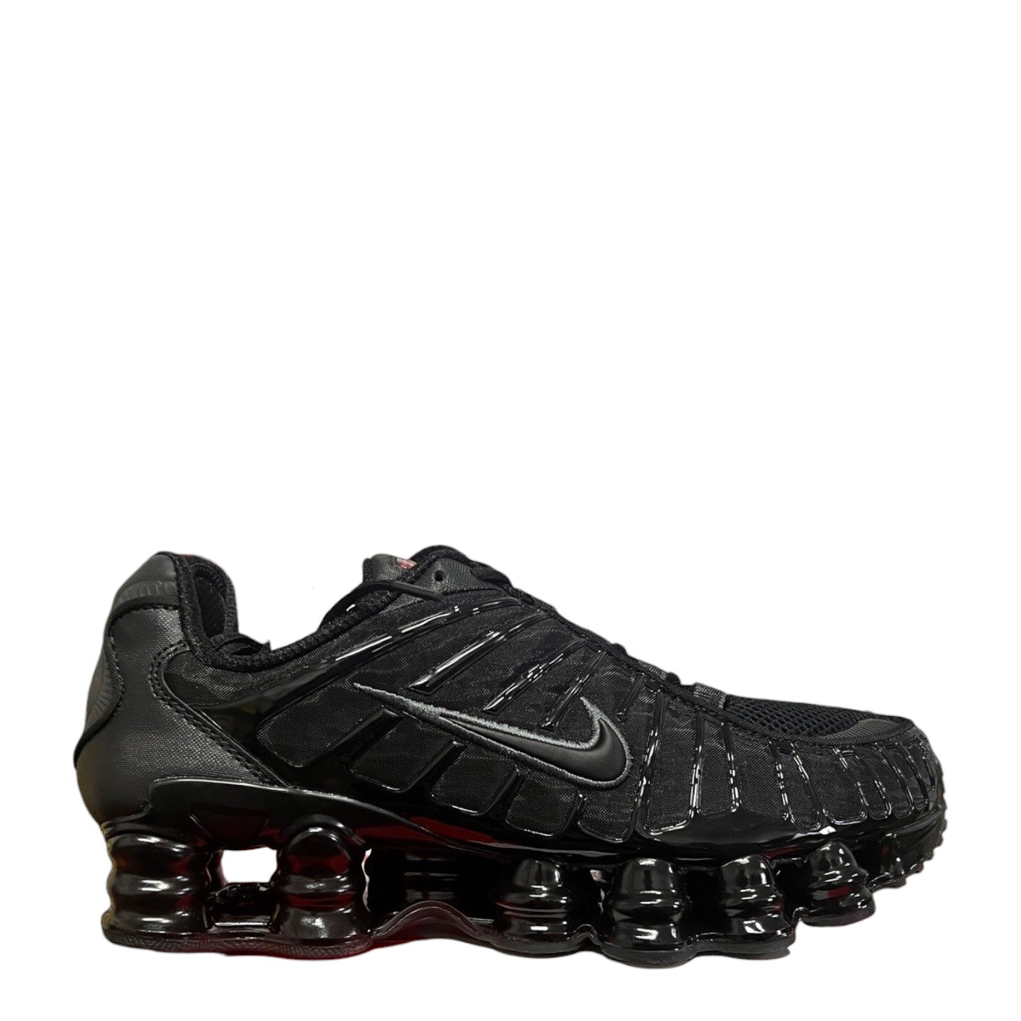 Luxury Chef Nike Shox TL all black sneakers with signature coil cushioning and mesh upper.