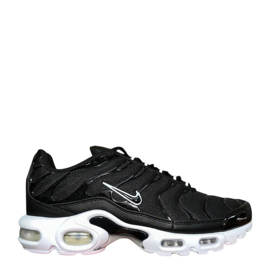 Luxury Chef Nike Air Max Plus TN black and white sneakers with visible air cushioning.