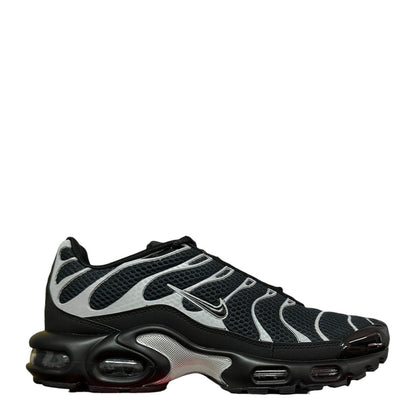 Luxury Chef Nike Air Max Plus TN sneakers in black with silver accents and visible air cushioning. Mesh upper.