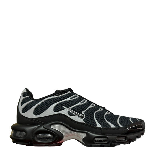 Luxury Chef Nike Air Max Plus TN sneakers in black with silver accents and visible air cushioning. Mesh upper.