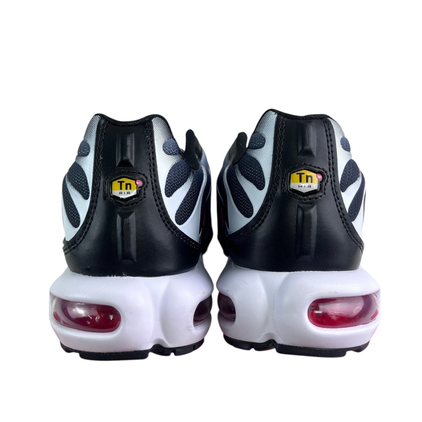 Luxury Chef Nike TN Air Max Plus sneakers in black, white, and grey with visible red air cushioning.
